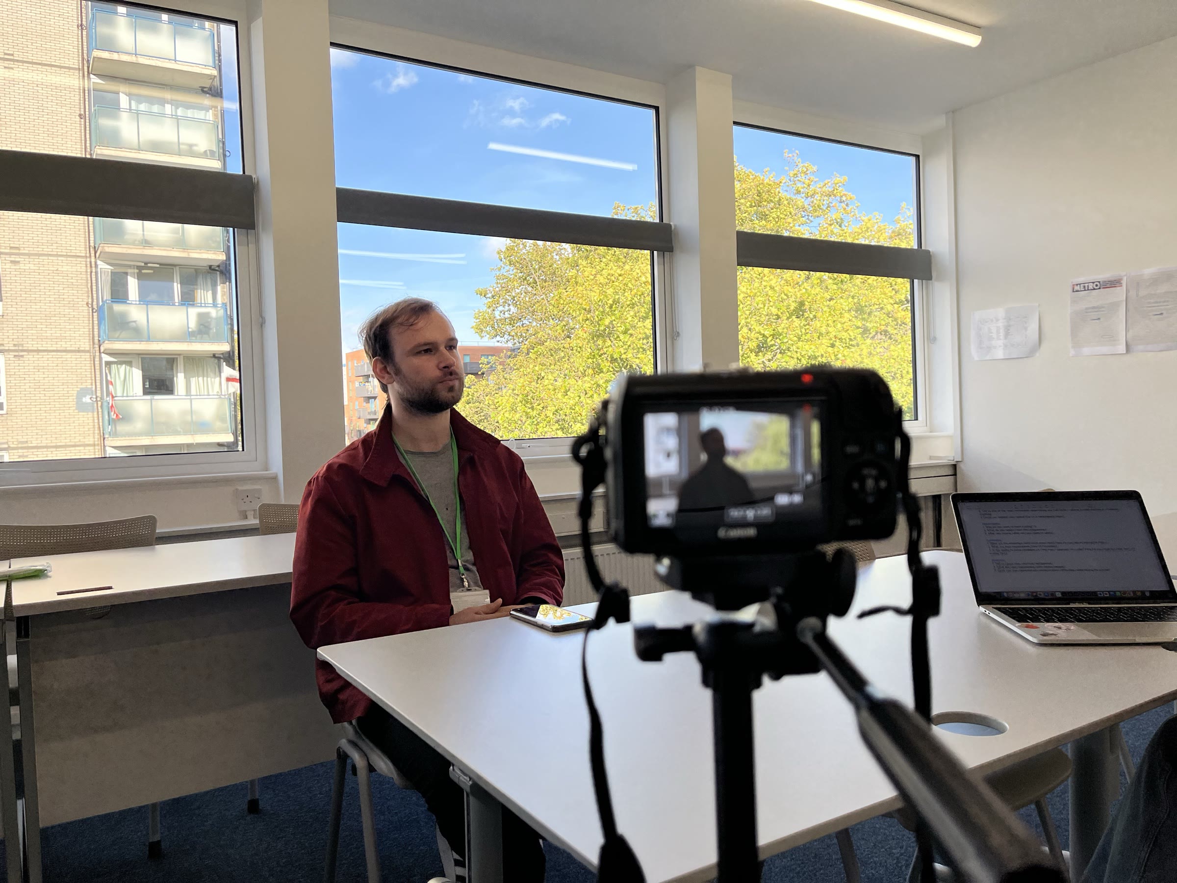 Interview setup on location: a camera on a tripod facing the interviewee